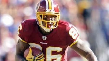 Former Redskins Clinton Portis surrenders to authorities