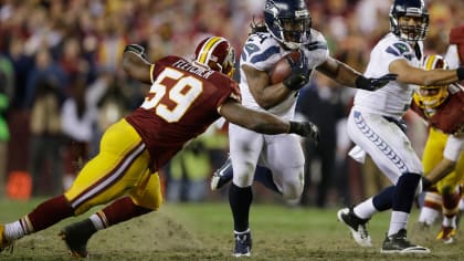 Washington Redskins inside linebacker London Fletcher (59) celebrates an  interception in the end zone during the third quarter of an NFL football  game against the St. Louis Rams in St. Louis, Sept …