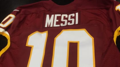 LOOK: Robert Griffin III presents Lionel Messi with Redskins