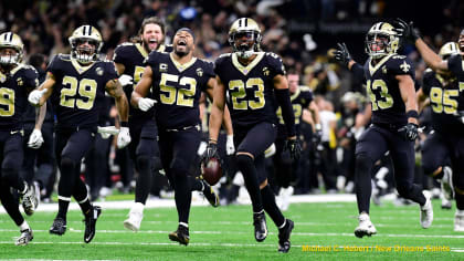 Taysom Hill New Orleans Saints Unsigned Carries the Ball in Black Jersey  Photograph