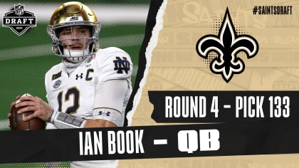New Orleans Saints quarterback Ian Book (16) carries between Green
