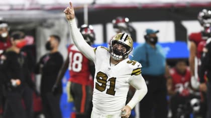 New Orleans Saints tight end Adam Trautman (82) wears a Salute to Service  towel during an NFL football game against the Los Angeles Rams, Sunday,  Nov. 20, 2022, in New Orleans. (AP