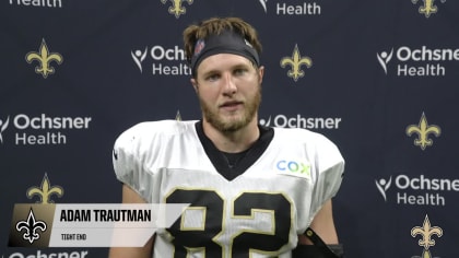 New Orleans Saints tight end Adam Trautman (82) runs the ball up the field  during an NFL football game against the Minnesota Vikings at Tottenham  Hotspur Stadium, Sunday, Oct. 2, 2022, in