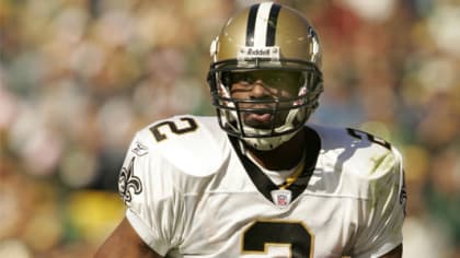 New Orleans Saints quarterback Aaron Brooks is chased out of the