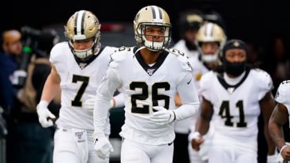 New Orleans Saints cornerback P.J. Williams (26) and quarterback