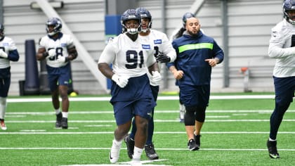 Seattle Seahawks guard Phil Haynes (60) and head coach Pete