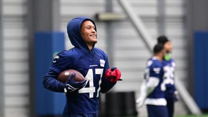 Seattle Seahawks cornerback Chris Steele holds a football during