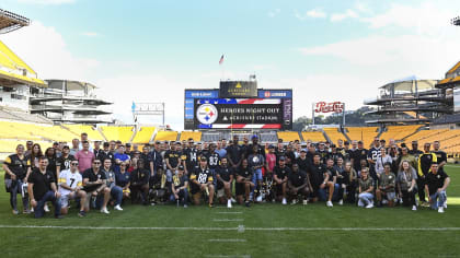 Former Pittsburgh Steelers cornerback Mel Blount greets members of