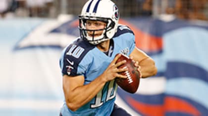 Tennessee Titans quarterback Jake Locker (10) scrambles against