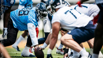 Tennessee Titans defensive tackle Jeffery Simmons (98) and linebacker  Rashad Weaver (99) talk before play starts