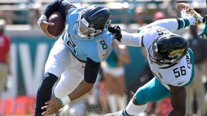 Raiders quarterback Marcus Mariota (8) scrambles past Los Angeles