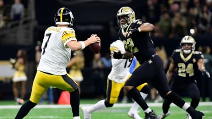 New Orleans Saints quarterback Drew Brees (black shirt) celebrates on the  field with Jonathan Vilma after the Saints beat the Vikings 31-28 to win  the NFC Championship game at the Louisiana Superdome