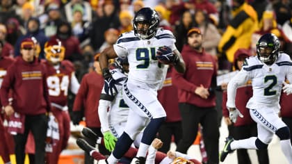 Washington Redskins wide receiver Terry McLaurin (17) makes a catch and is  pulled down by New York Jets strong safety Jamal Adams (33) during the  first half of an NFL football game