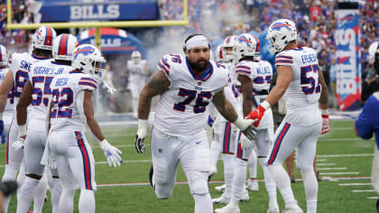 Buffalo Bills defensive linemand Eli Ankou engulfs Rypien for