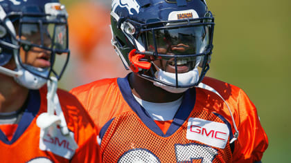 Denver Broncos running back Ronnie Hillman (23) tries to leap over