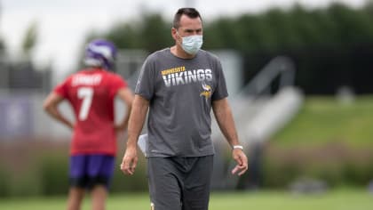 Baltimore Ravens assistant coach Gary Kubiak talks with