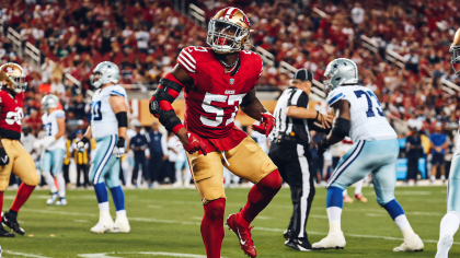 Dre Greenlaw of the San Francisco 49ers on the sideline before the