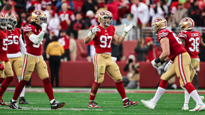 San Francisco 49ers defensive end Charles Omenihu poses with San