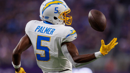 Los Angeles Chargers Justin Herbert (L) and Joshua Palmer smile at the end  of the first half of game against the New York Giants at SoFi Stadium on  Sunday, December 12, 2021