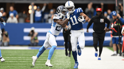 Philadelphia Eagles running back Trey Sermon (22) falls over Indianapolis  Colts linebacker Grant Stuard (41) during