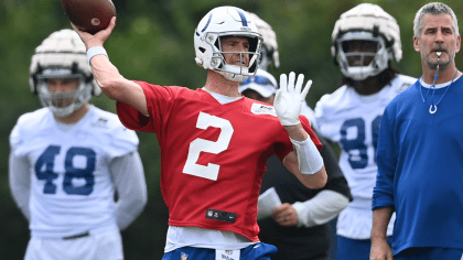 FILE - Indianapolis Colts quarterback Matt Ryan holds up his new jersey  following a press conference at the NFL team's practice facility in  Indianapolis on March 22, 2022. After four straight losing