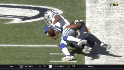 Dallas Cowboys wide receiver Cedrick Wilson (11) gains first down yardage  after catching a pass in the first half of an NFL football game against the  New York Giants in Arlington, Texas