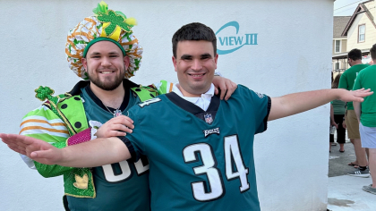 Matt Craig, in the Mummers outfit, with his brother, who is on the autism spectrum