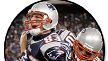 New England Patriots defensive back Devin McCourty (32) and linebacker  Brandon King (36) celebrate a fumble recovery by McCourty in the third  quarter against the Indianapolis Colts at Gillette Stadium in Foxborough