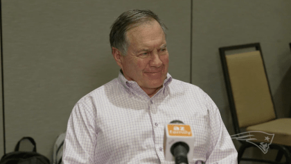 New England Patriots head coach Bill Belichick, right, talks with