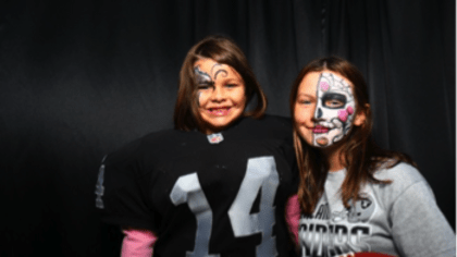 A fan of the Oakland Raiders dresses in full face paint with Raider