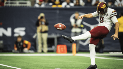 Washington Commanders punter Tress Way (5) punts the ball during