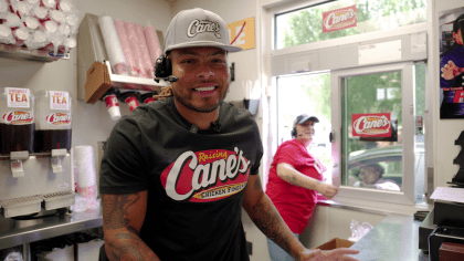 Saints safety Tyrann Mathieu works at Raising Cane's to raise