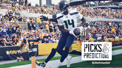 Fans wear Seattle Seahawks head gear as they watch warmups before an NFL  football game between the Pittsburgh Steelers and the Seattle Seahawks,  Sunday, Oct. 17, 2021, in Pittsburgh. (AP Photo/Fred Vuich