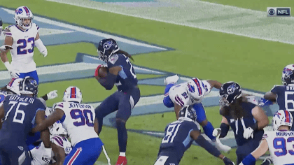 Derrick Henry tosses Josh Norman down during Bills-Titans game