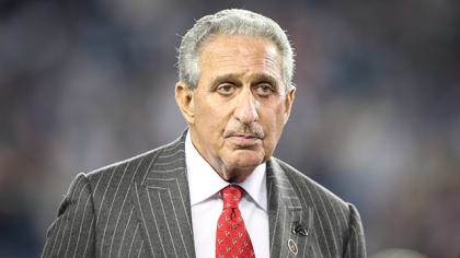 Atlanta Falcons owner Arthur M. Blank watches a replay of San