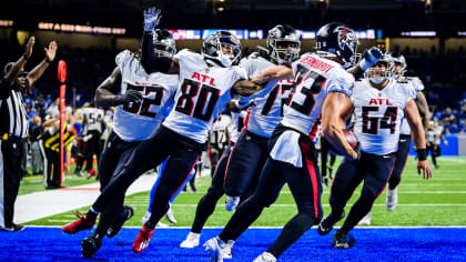 Atlanta Falcons running back Qadree Ollison (32) celebrates his 9-yard  touchdown run against the Jacksonville Jaguars with offensive tackle Kaleb  McGary (76) during the first half of an NFL preseason football game