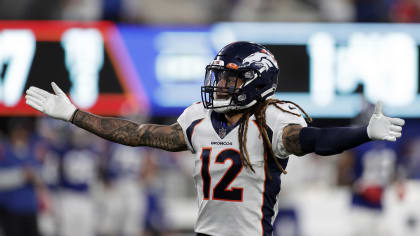 Denver Broncos defensive back Mike Ford (12) walks off the field