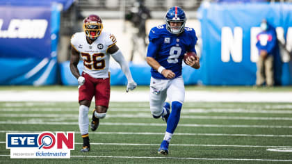 Washington Commanders defensive end Montez Sweat (90) looks across the line  of scrimmage alongside safety Kamren Curl in the second half of an NFL  football game against the Atlanta Falcons, Sunday, Nov.