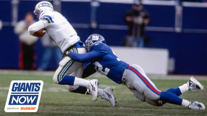 New York Giants Michael Strahan reacts to a sack in week 13 at