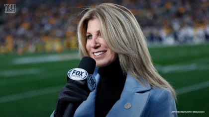 Fox Sports anchors conduct an interview after an NFL football game