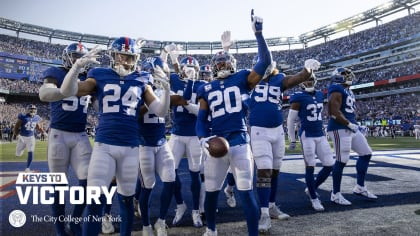 New York Giants Eli Manning takes a snap in the fourth quarter against the  New Orleans Saints in week 14 of the NFL season at MetLife Stadium in East  Rutherford, New Jersey