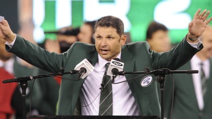 New York Jets wide receiver Wayne Chrebet puts his hands in the air while  being honored during half time of the Miami Dolphins, New York Jets game at  Giants Stadium in East