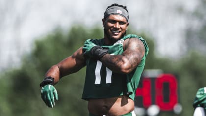 New York Jets linebacker Jermaine Johnson (52) warms up before playing  against the Buffalo Bills in