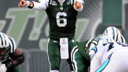 New York Jets quarterback Mark Sanchez (6) scrambles against the