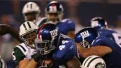 New York Giants Reuben Droughns is tackled by Washington Redskins