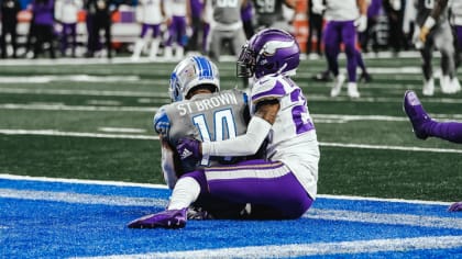 Amon-Ra St. Brown Detroit Lions Unsigned Makes Touchdown Catch Photograph