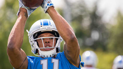 Lions safety Don Carey runs football camp