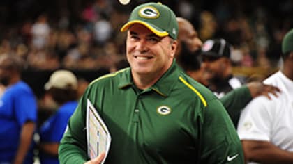 Green Bay Packers Head Coach Mike McCarthy holds up the Vince