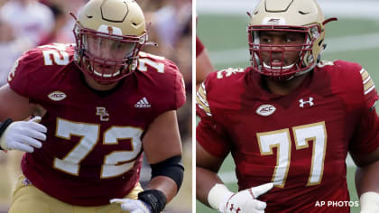 Boston College offensive guard Zion Johnson holds a team jersey