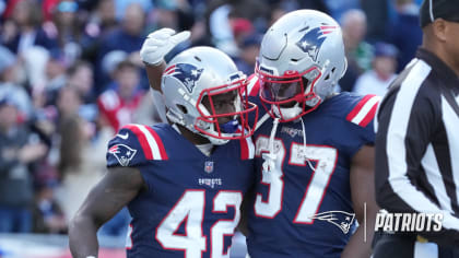 New England Patriots running back J.J. Taylor (42) walks off the